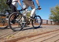 Cyclists cycling in the nature by the trees in spring