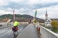 Cyclists cycling on Rhine River Bridge in Stein Am Rhein, an old town on River Rhine in Schaffhausen, Switzerland