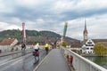 Cyclists cycling on Rhine River Bridge in Stein Am Rhein, an old town on River Rhine in Schaffhausen, Switzerland