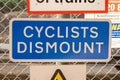 Cyclists Dismount warning sign