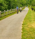 Cyclists Enjoying a Morning Ride on the Roanoke River Creek Greenway Royalty Free Stock Photo