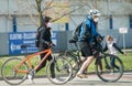 Cyclists with fabric veil in the park