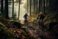 cyclists going down a mountain slope in the forest Royalty Free Stock Photo