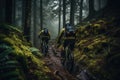 cyclists going down a mountain slope in the forest Royalty Free Stock Photo