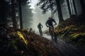 cyclists going down a mountain slope in the forest Royalty Free Stock Photo
