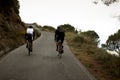 Cyclists going up a slope