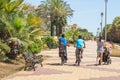 Cyclists on the promenade, Costa de Luz, Ayamonte, Spain.