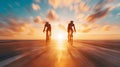 Cyclists Racing at Sunrise on Open Road Royalty Free Stock Photo