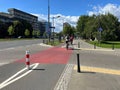 Cyclists riding bicycles on lane in city Royalty Free Stock Photo