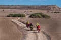 Cyclists riding on mountain serpentine