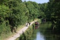 Cyclists runner, towpath, Kennet and Avon canal Royalty Free Stock Photo