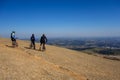 Cyclists on the top of a stone hill. mountain biking. mountainscape, panoramic view. adventure sport