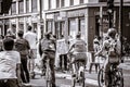 cyclists in traffic in paris Royalty Free Stock Photo