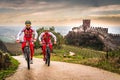 Cyclists train on the hills surrounding the castle of Soave.