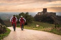 Cyclists train on the hills surrounding the castle of Soave.