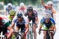 Cyclists from various teams cycle Royalty Free Stock Photo