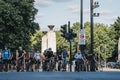 Cyclists waiting on a red traffic light to cross a road in London, UK, in summer