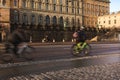 Cyclists on wet road commuting environmentally friendly way