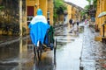 Cyclos run on street in Hoi An, Vietnam