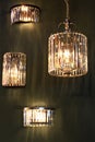 Cylinder and half cylinder shaped crystal chandeliers and wall lights with long vertical crystals