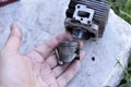 Cylinder and piston from internal combustion engine engine in hand