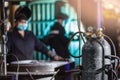 Cylinders with oxygen and argon gas, background blur worker welder is doing work