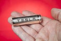 Cylindrical battery for Tesla electric cars, in human palm.