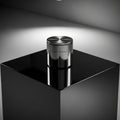 Cylindrical container with a polished reflective surface sits Royalty Free Stock Photo