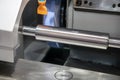 The cylindrical grinding machine make the surface finishing on the metal shaft control by CNC program. Royalty Free Stock Photo