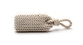 Cylindrical knotted jute object with a handle, crafted from thick rope loops. The Royalty Free Stock Photo