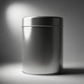 A cylindrical metallic can is positioned on a flat surface under studio lighting. The can Royalty Free Stock Photo