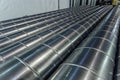 Cylindrical steel pipes. Round metal tubes made in metalworking workshop Royalty Free Stock Photo