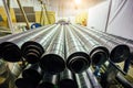 Cylindrical steel pipes. Round metal tubes in metalworking workshop Royalty Free Stock Photo