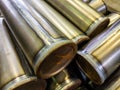 Cylindrical steel tubes with tig argon arc welded seams - close-up industrial background with selective focus and blur