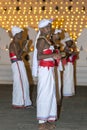 Cymbal Players or Thalampotakaruwo perform in front of the Temple of the Sacred Tooth Relic in Kandy, Sri Lanka. Royalty Free Stock Photo