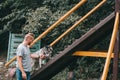 cynologist training with siberian husky dog on stairs obstacle Royalty Free Stock Photo