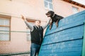 Cynologist training working dog on playground Royalty Free Stock Photo