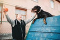 Cynologist training working dog on playground Royalty Free Stock Photo