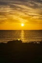 Cyprus beautiful sunset at the sea with rocks and cloudy sky Royalty Free Stock Photo