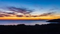 Cyprus beautiful sunset at the sea with rocks and cloudy sky Royalty Free Stock Photo