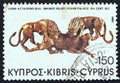 CYPRUS - CIRCA 1980: A stamp printed in Cyprus shows lions attacking bull, bronze relief, Vouni Palace 5th century B.C., circa 1
