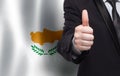 Cyprus concept. Businessman showing thumb up on the background of flag of Cyprus Royalty Free Stock Photo