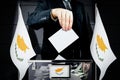 Cyprus flags, hand dropping voting card - election concept Royalty Free Stock Photo