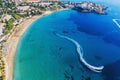 Cyprus landscape. Aerial panoramic view of Coral bay beach with jet ski and people having fun. Mediterranean vacation Royalty Free Stock Photo