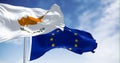 Cyprus national flag waving with the European Union flag on a clear day