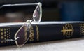 Cyrillic holy bible with glasses