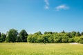 Cytadela Park, green field with blue sky in Poznan, Poland Royalty Free Stock Photo