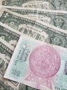 Czech banknote of 100 korun and American one dollar bills