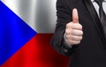 Czech concept. Businessman showing thumb up on the background of flag of Czech Republic