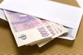 Czech economy and finance - czech crown banknotes in a envelope - bribe and corruption